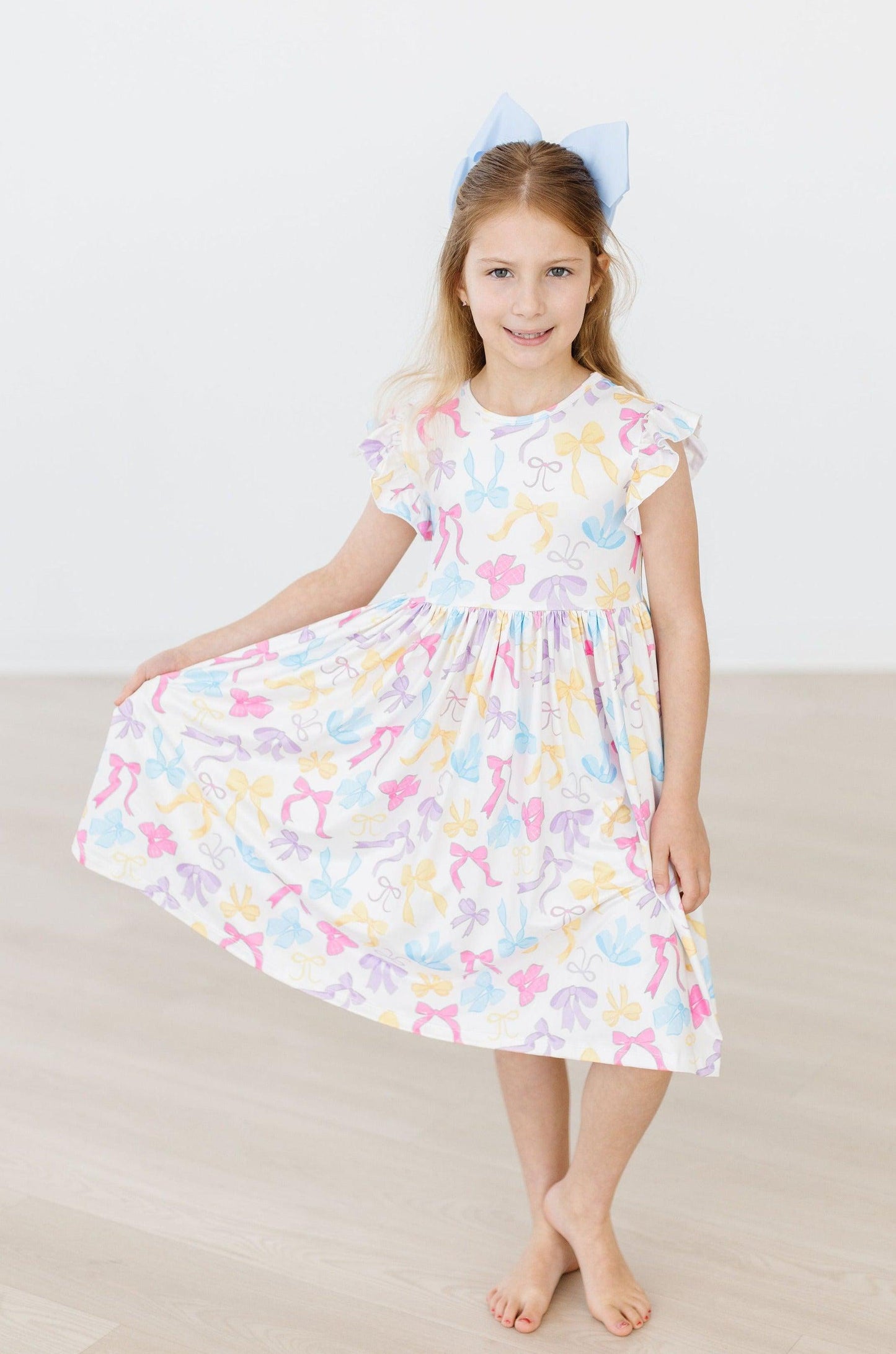 BOW-TASTIC FLUTTER SLEEVE TWIRL DRESS