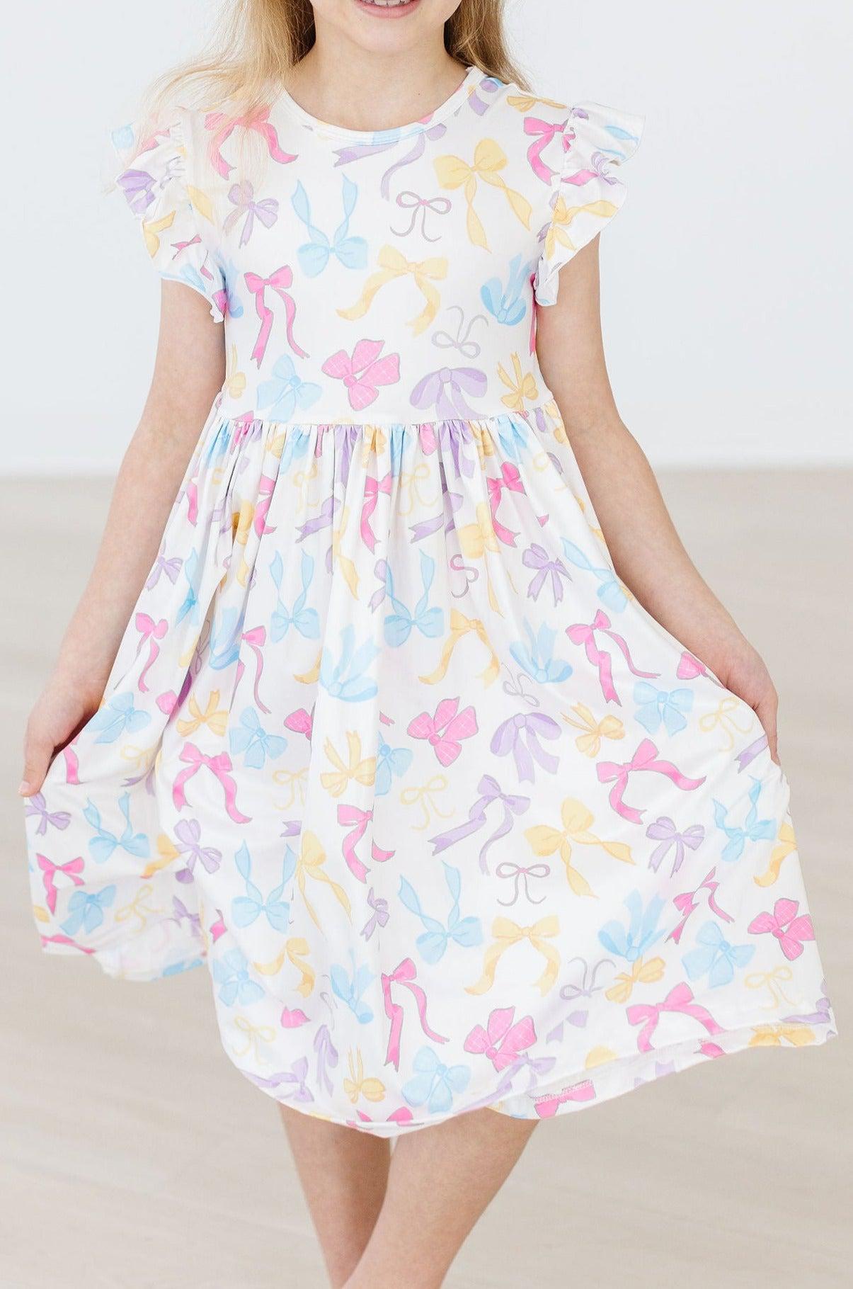 BOW-TASTIC FLUTTER SLEEVE TWIRL DRESS